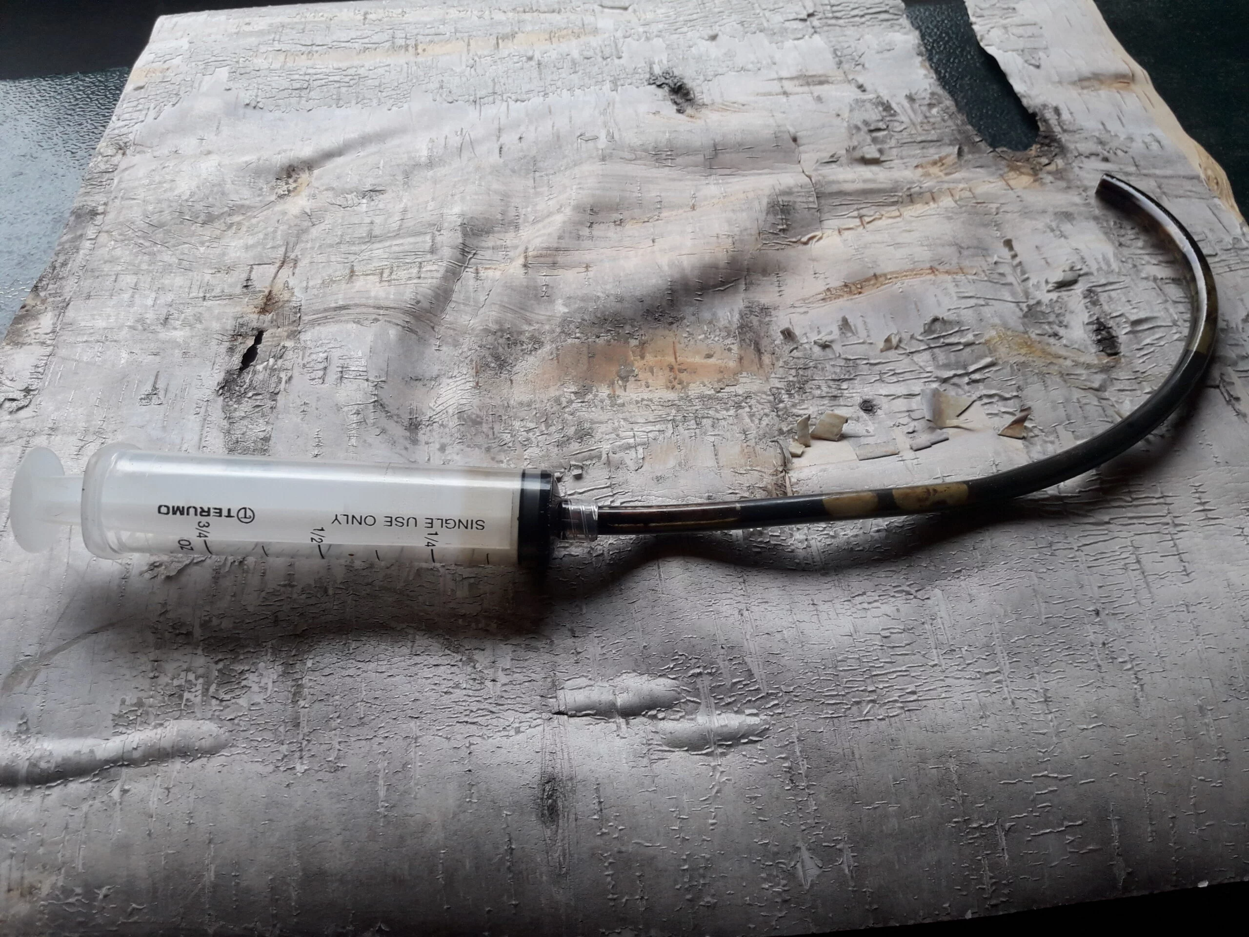 remove water from birch tar oil